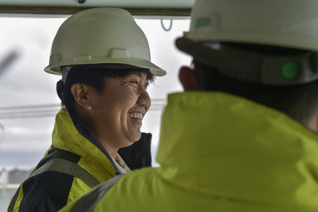 smiling seafarer with colleague